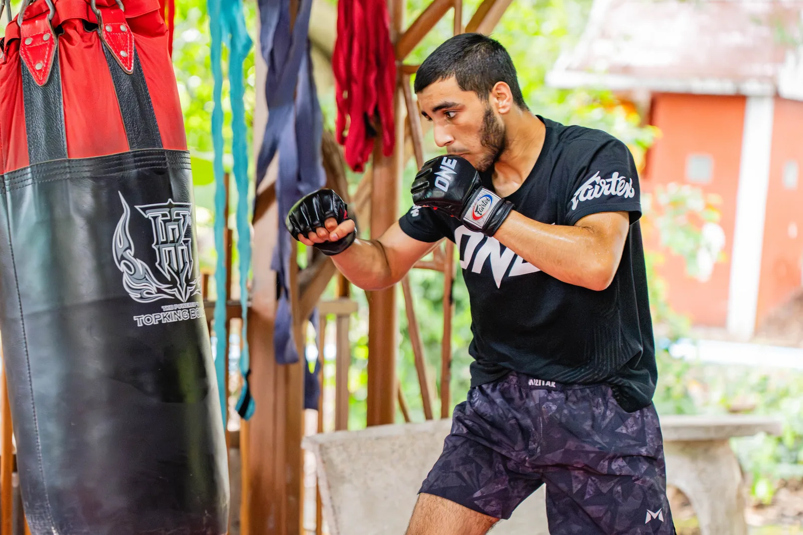 Student working the heavy bag